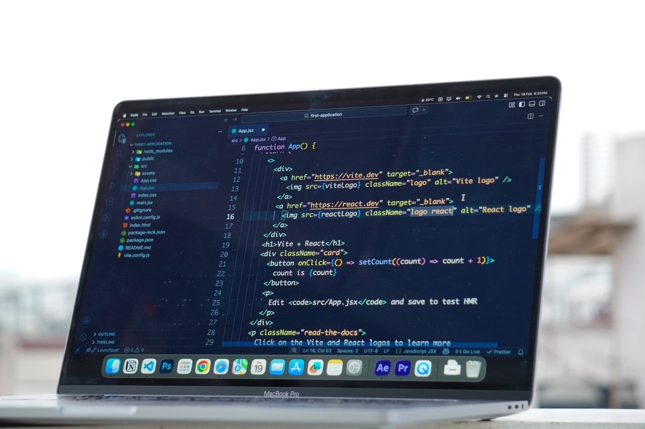 Crafting Captivating Headlines: Your awesome post title goes here Coding on a laptop outdoors, showcasing a rooftop urban lifestyle in Surat, India.